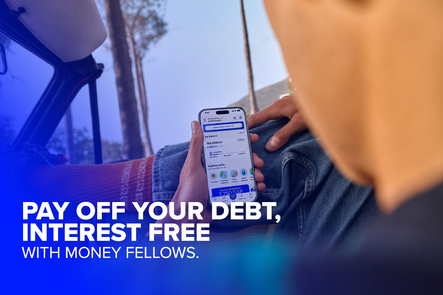 a person holding a mobile while its screen opening on Money Fellows app which is regulated by the CBE & Banque Misr
